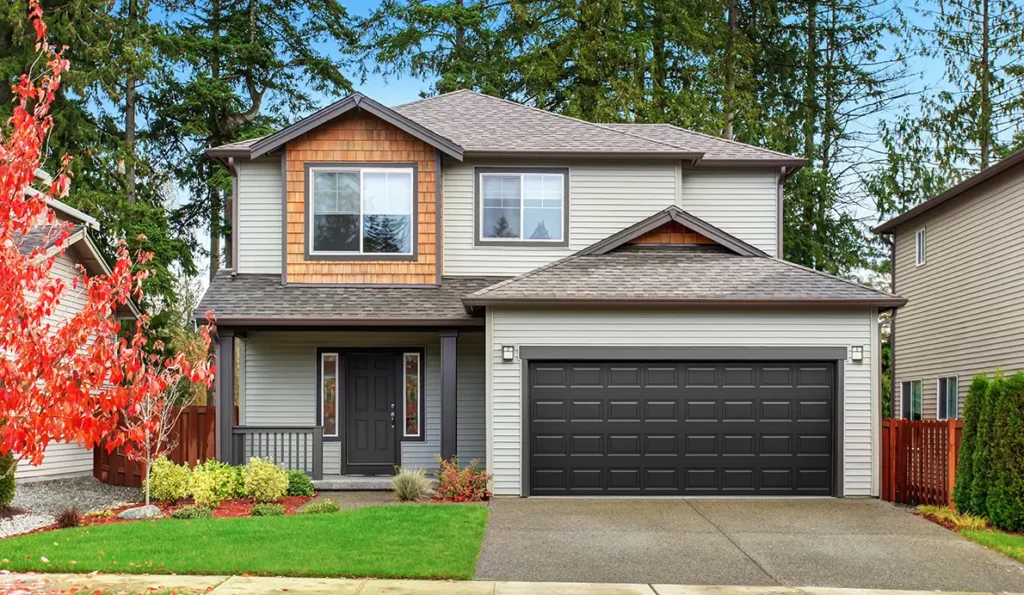 Newly installed steel garage door on a residential home
